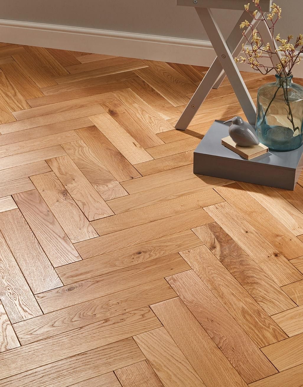Oak herringbone wood flooring laid in a living space