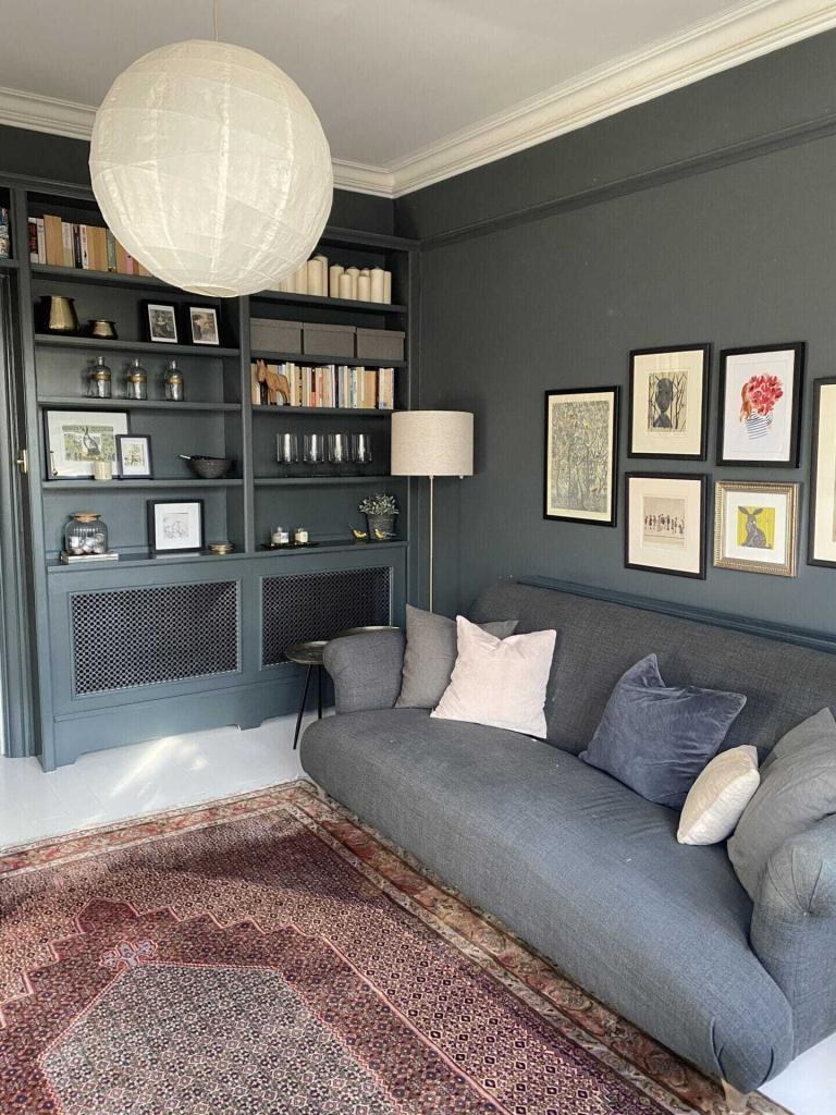 Fitted alcove shelving and radiator cover painted in deep grey, recent work by Masonry Milan in London